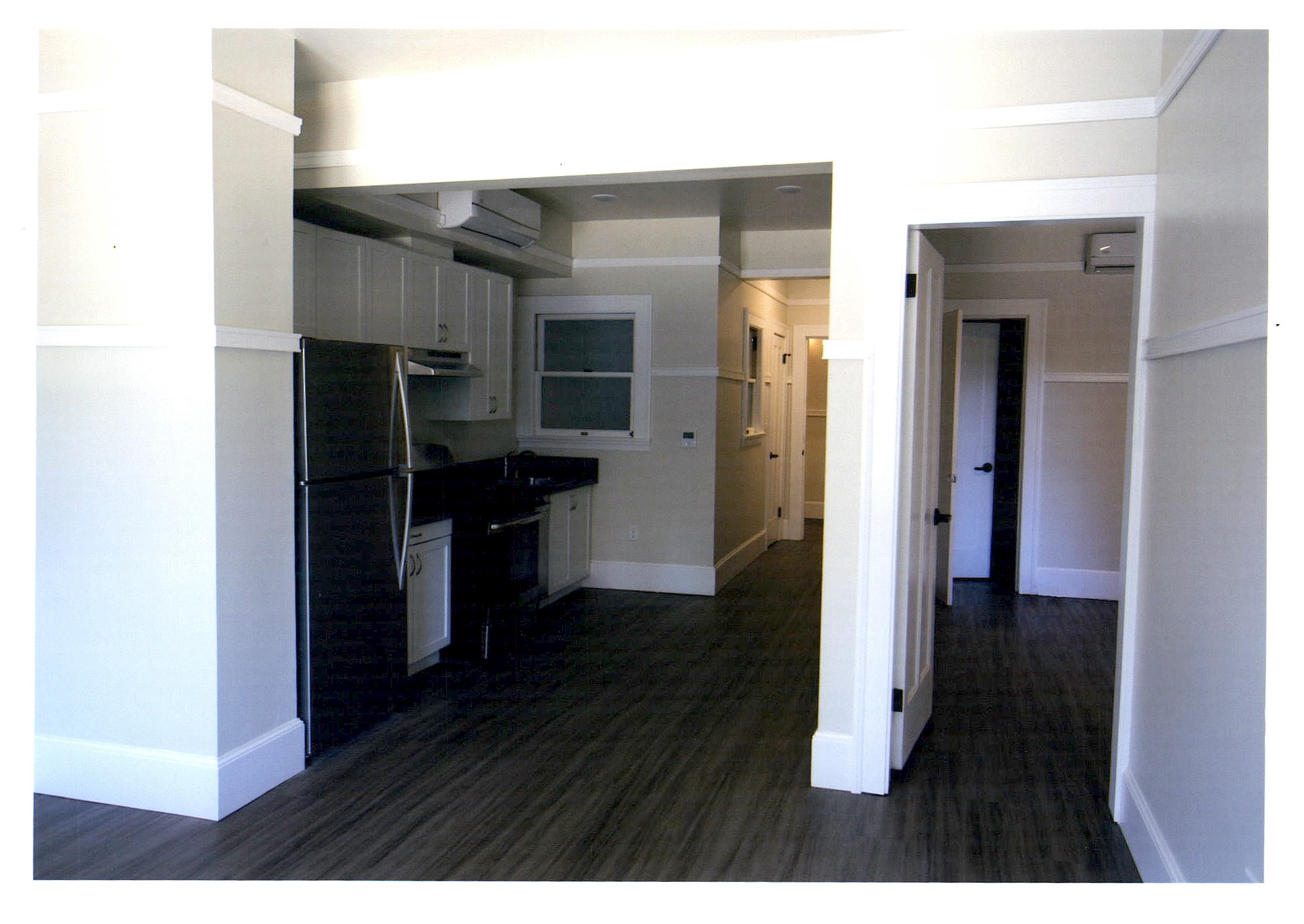 After:  another apartment unit looking towards the hall entrance. Note retained windows in light wells.